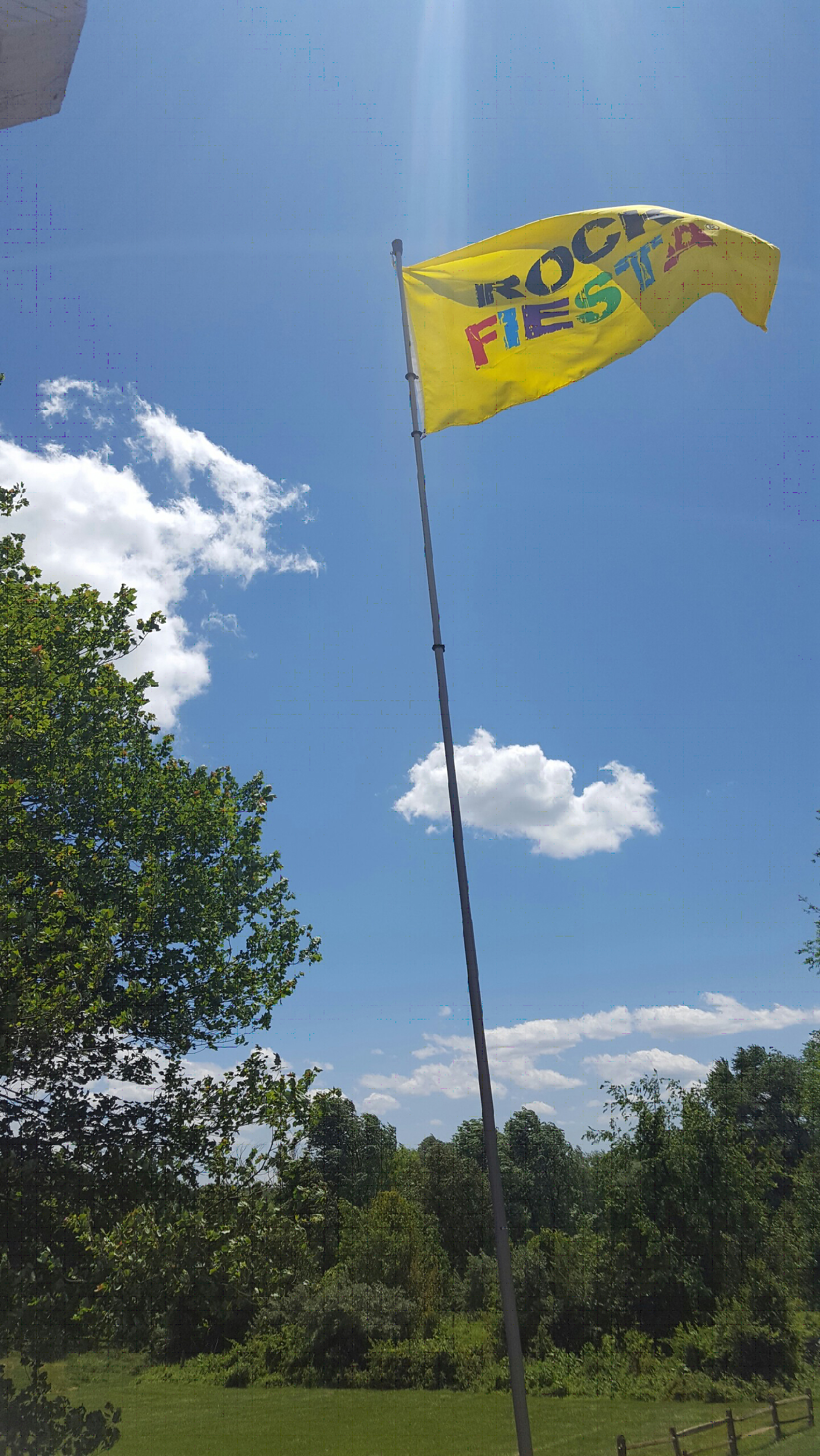 Rock Fiesta on a flag pole